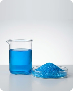 Copper sulphate chemical solution in laboratory beaker with powder sample